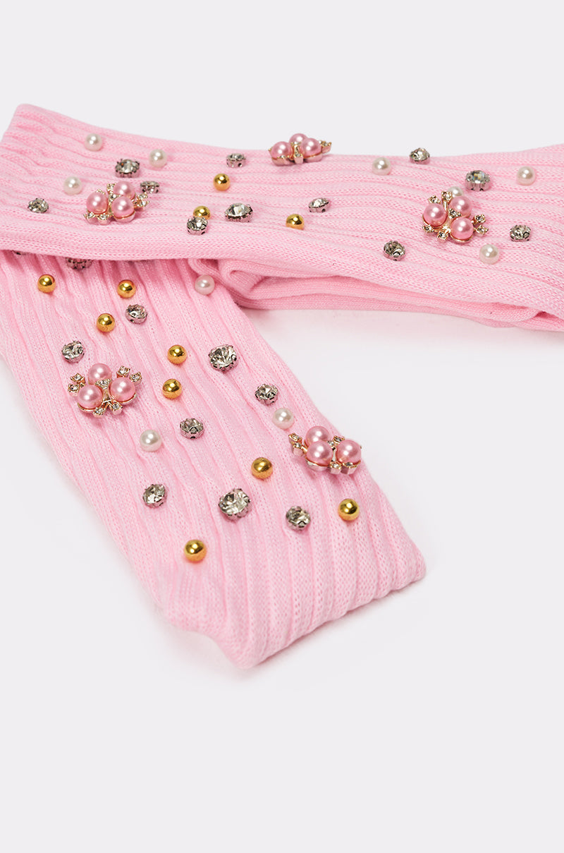 The EMBELLISH ME SOCKS are pink crew socks made from ribbed knit, adorned with pearls, gold and silver beads, and sparkling rhinestones for a delicate embellished look. 5