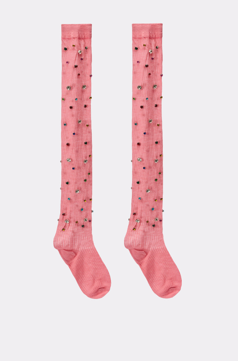 The COMPLETE THE LOOK EMBELLISHED SOCKS are pink knee-highs decorated with scattered colorful beads. Laid flat on a plain light background, the front side of these stylish embellished socks is clearly displayed. 3