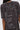 Someone wears the IT GIRL SPLATTERED GRAPHIC TSHIRT DRESS WITH RHINESTONES—a trendy oversized cotton dress featuring bleach splatter, white text and dots on the back with words like “INTRO” and “PRIORITIES TO LAST.”.