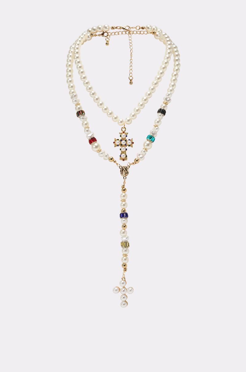 The ON BISCAYNE NECKLACE features double-layered pearls with colorful beads, a gold cross charm centerpiece, a dangling strand with a pearl cross, and an adjustable gold chain clasp. 0