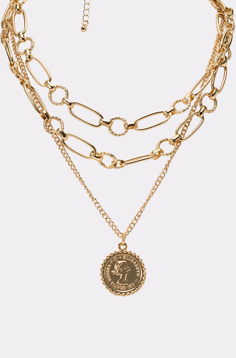 Elevate your style with the GET THAT COIN NECKLACE—a layered gold chain featuring chunky oval and round links plus a bold coin pendant, perfect for festivals or adding everyday glamour. 2