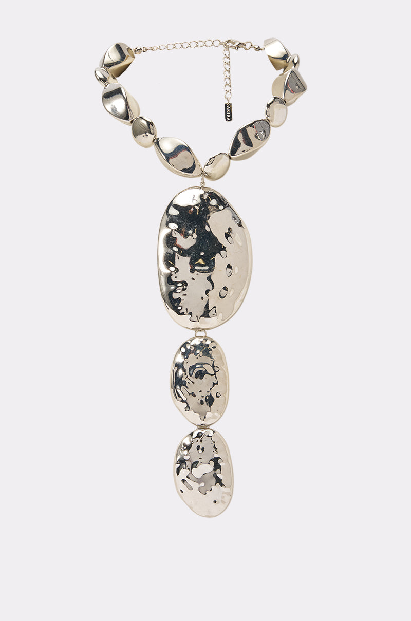 Make an impact with the LIQUID CHROME STATEMENT NECKLACE—a striking piece of sculptural jewelry featuring large, uniquely shaped silver beads and three cascading oval pendants embellished with abstract black designs on a polished chrome finish.