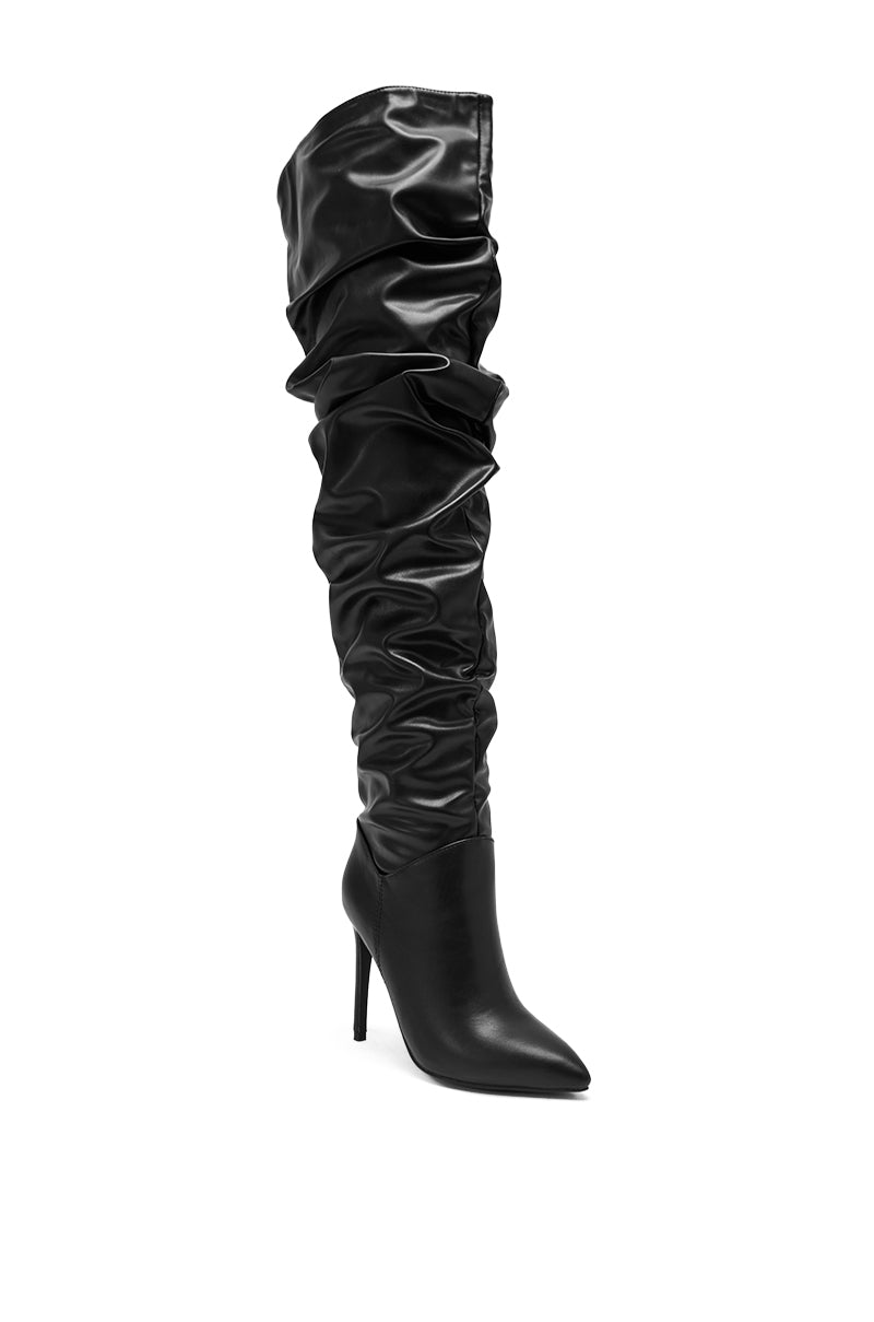 The AZALEA WANG TORVIS Ruched Stiletto Boot in Black features a single thigh-high design with a pointed toe, slouchy ruched shaft, and a shiny faux leather finish.