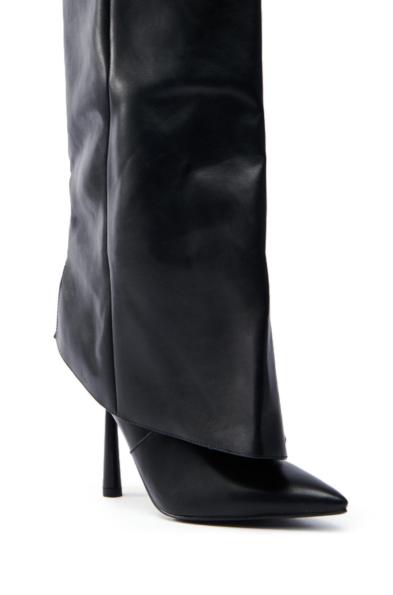 Close-up of the AZALEA WANG TRACKSTAR BLACK STILETTO BOOT, featuring a sleek faux leather design. This black, pointed-toe boot with a sharp stiletto heel and glossy finish offers a stylish high-fashion silhouette.