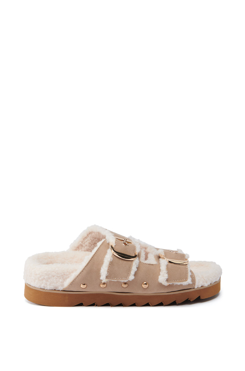 Side view of the AZALEA WANG TRESOR TAN FUZZY SANDAL featuring a fluffy fleece lining and two adjustable straps with buckle closures. The sandal is designed with a textured, flatform sole to ensure comfort and grip.