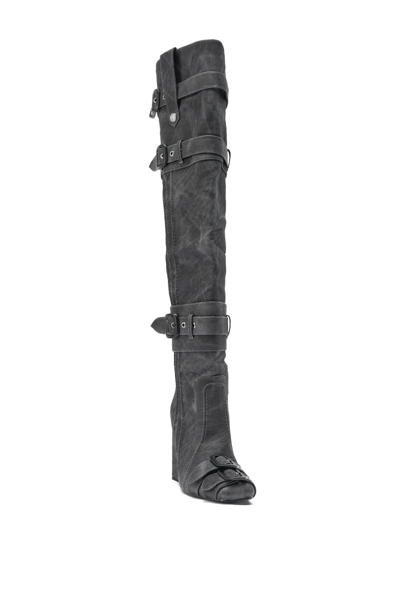 The AZALEA WANG TRILLION CHARCOAL CHUNKY THIGH HIGH BOOT features a tall black leather design with multiple buckle straps, a block heel, and a slightly pointed toe, shown from the front on a white background.