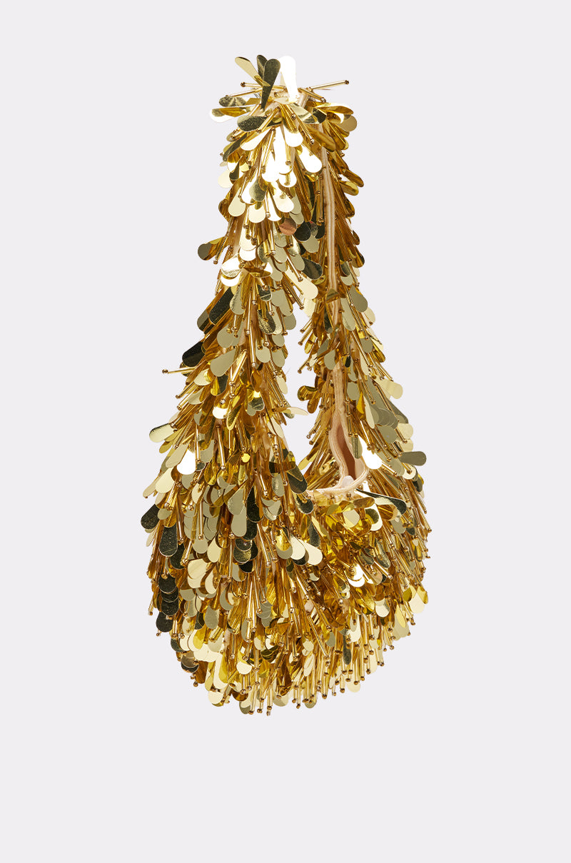 THE NOSTALGIA SEQUIN PURSE IN GOLD shines with metallic sequins, fringe accents, beaded details, and a looped top handle for a glamorous textured look.