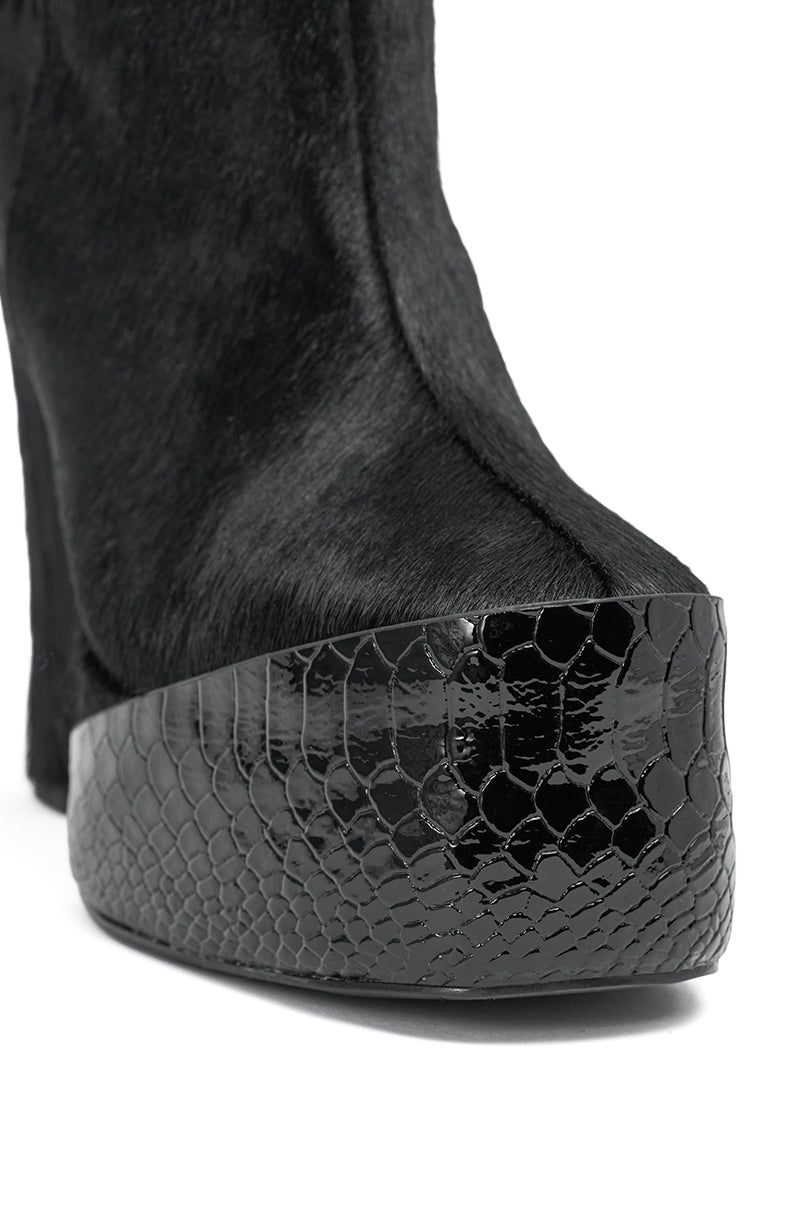 Close-up of the AKIRA GOLD TROT BLACK BOOTIE, showcasing a glossy textured snakeskin platform toe and a luxe genuine calf hair upper.
