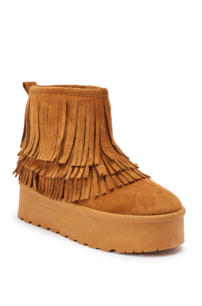 The AKIRA BROWN FAUX SUEDE FRINGE BOOTIE features layered fringe details, faux suede material, and a thick, ridged flatform sole.