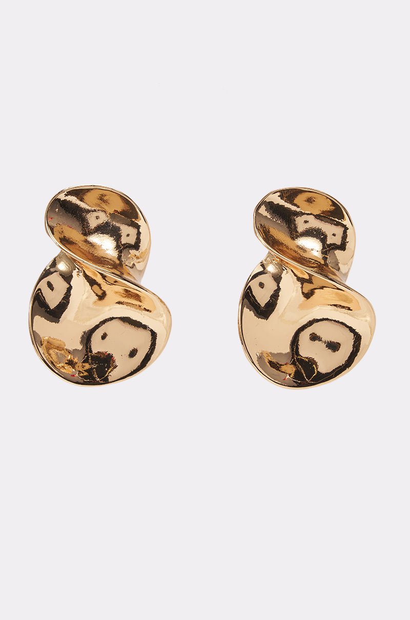 The DRIPPIN’ IN GOLD EARRINGS—an abstract pair featuring a shiny gold, wavy, sculpted twist design—are displayed against a plain white background, perfect for effortless day-to-night style.
