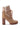 The AZALEA WANG TWILLA EMBELLISHED TAN CHUNKY BOOTIE is a stylish ankle-high, faux suede bootie in a tan color, adorned with rhinestone detailing. It features a chunky brown heel, lace-up front with gold accents, and a warm white fleece lining peeking over the top. The rugged sole adds extra grip.