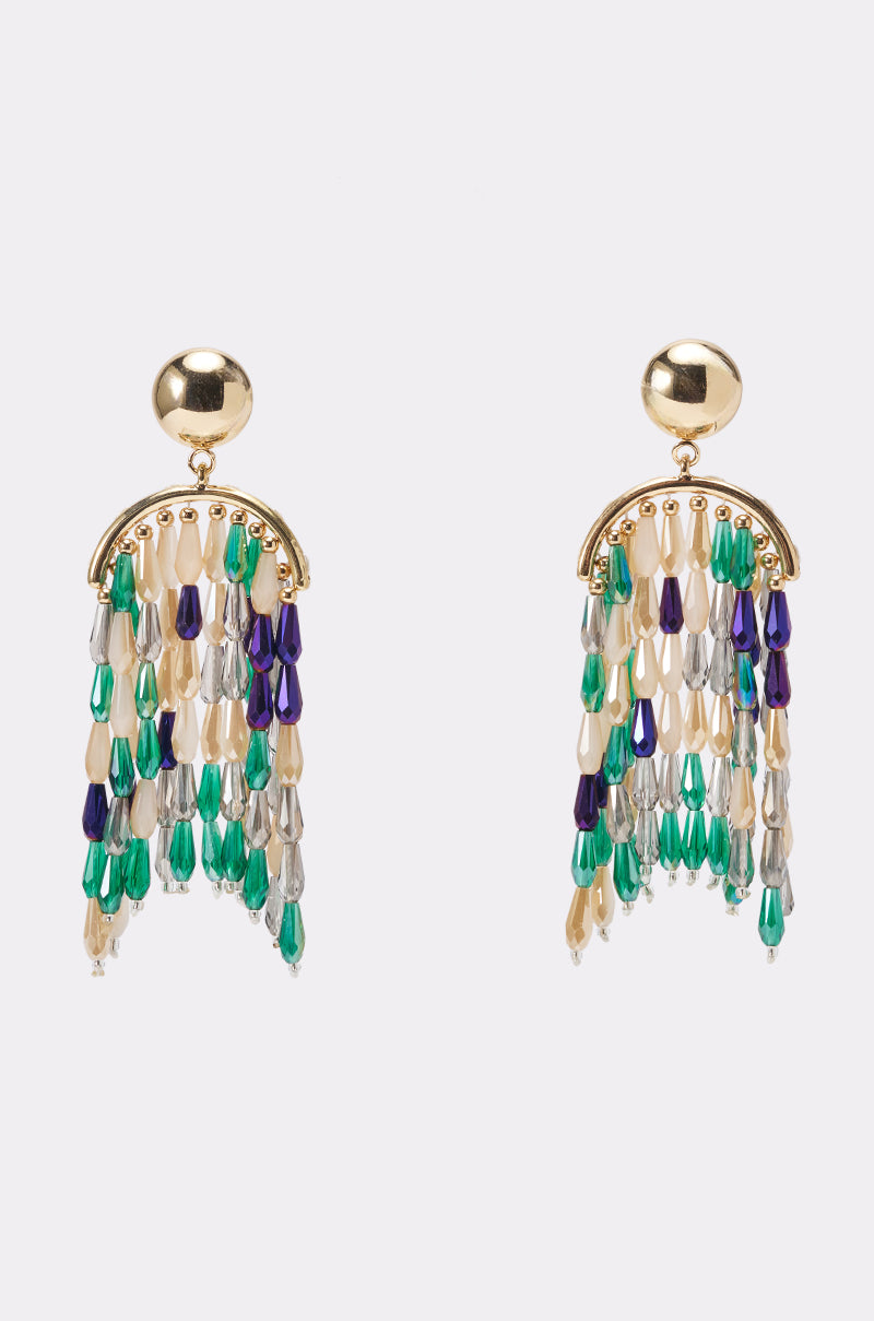 The TAKE ME TO THE PARTY EARRING features gold statement drops with round studs and cascading cream, green, teal, blue, purple, and silver beaded fringe—perfect for adding a pop of color to your summer party look.