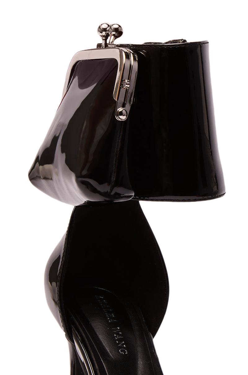The AZALEA WANG TZIVA BLACK COIN PURSE PUMP is a faux patent leather stiletto with an ankle strap styled like a vintage coin purse, complete with metal clasp closure.