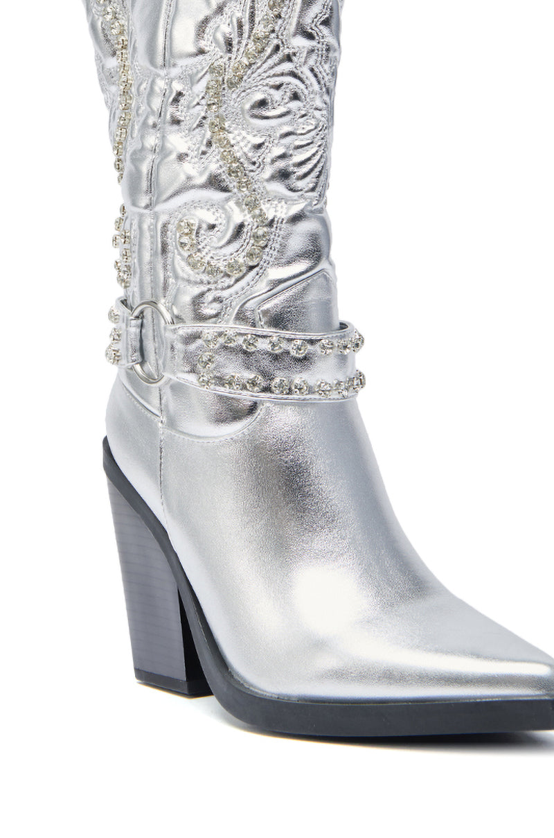 The AZALEA WANG UMBRA SILVER WESTERN BOOT features metallic faux leather, baroque-style embroidery, rhinestone details, a pointed toe, and a chunky high heel.