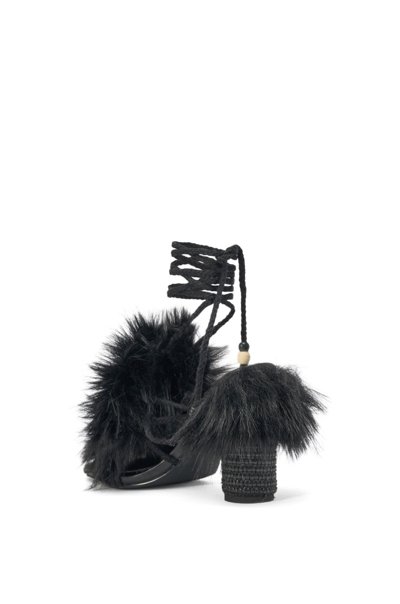 The AKIRA GOLD UMIKA BLACK FUR BLOCK SANDAL features plush black faux fur on the toe strap, a chunky wrapped heel, and lace-up ankle straps with bead accents—ideal for elevating any look. 4