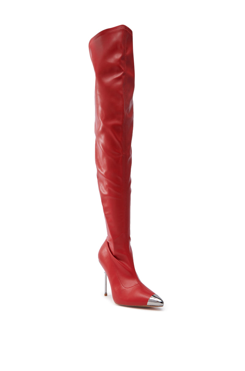 Displayed against a white background is the UNA RED STILETTO BOOT, featuring a single thigh-high silhouette and a pointed metallic toe cap.