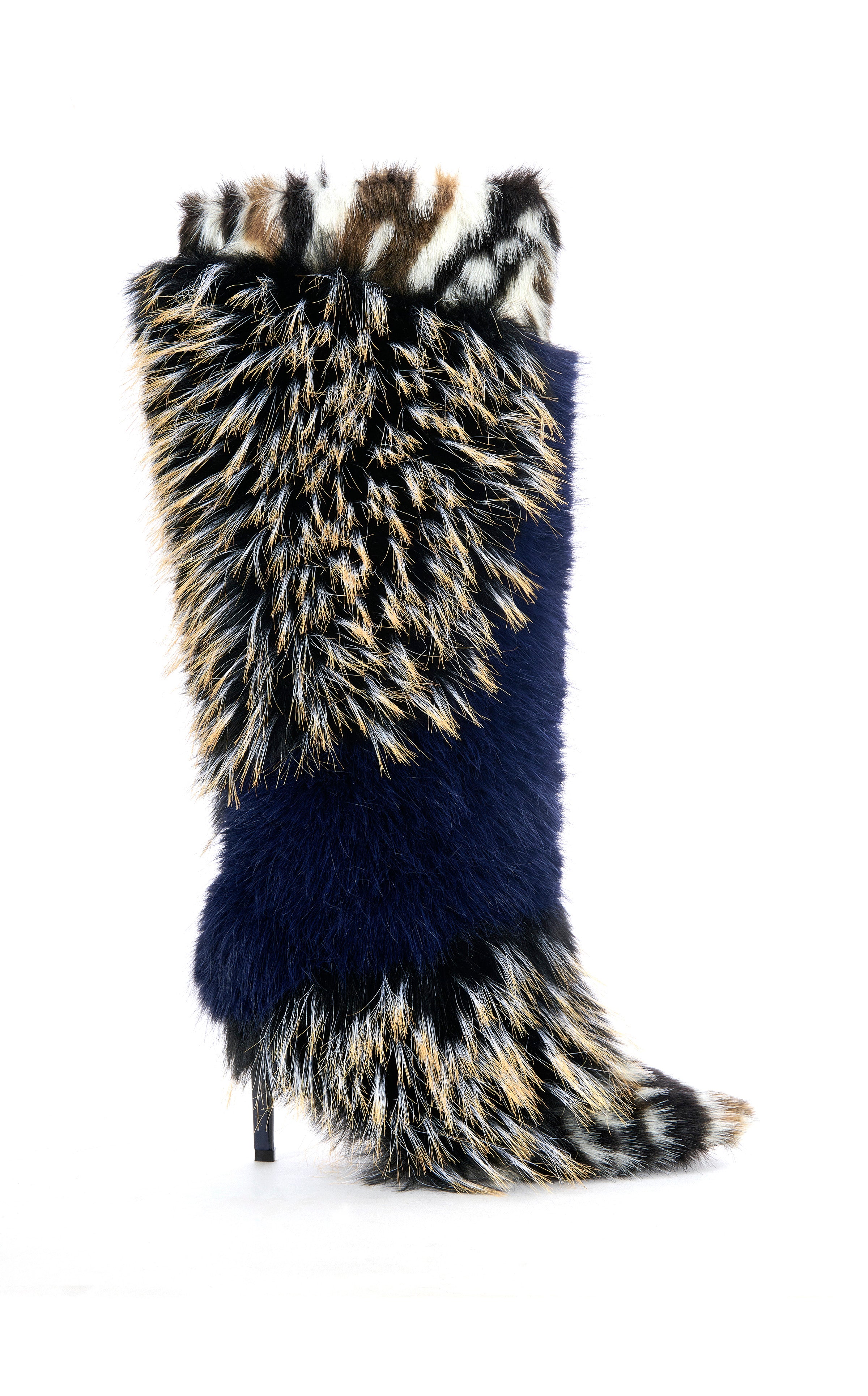 The AZALEA WANG UPENDO NAVY MULTI FUR BOOT is a knee-high stiletto with a pointed toe and bold black, white, tan, and navy faux fur patterns for a wild, textured look.