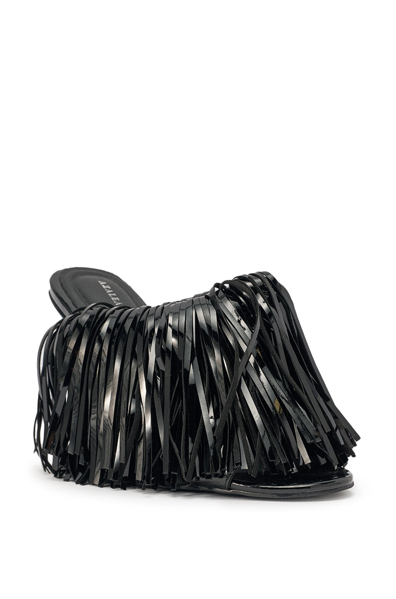 The AZALEA WANG VAILYN Black Fringe PU Wedge Sandal is a black slip-on mule with a closed toe and shiny layered fringe strips on top of a fringe wedge heel, set against a plain white background. 6