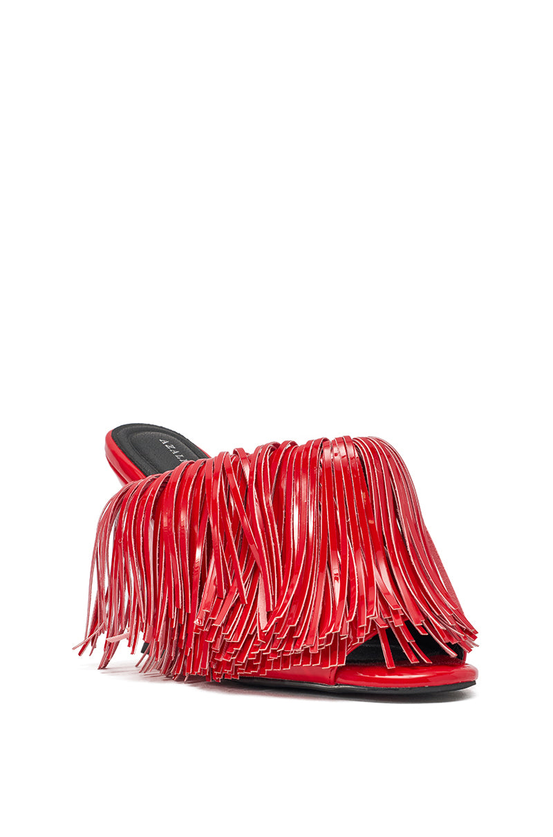 The AZALEA WANG VAILYN RED FRINGE PU WEDGE SANDAL features a cherry-red hue, slip-on mule style, shiny layered fringe on the upper, an open toe, and a comfortable wedge sole. 4