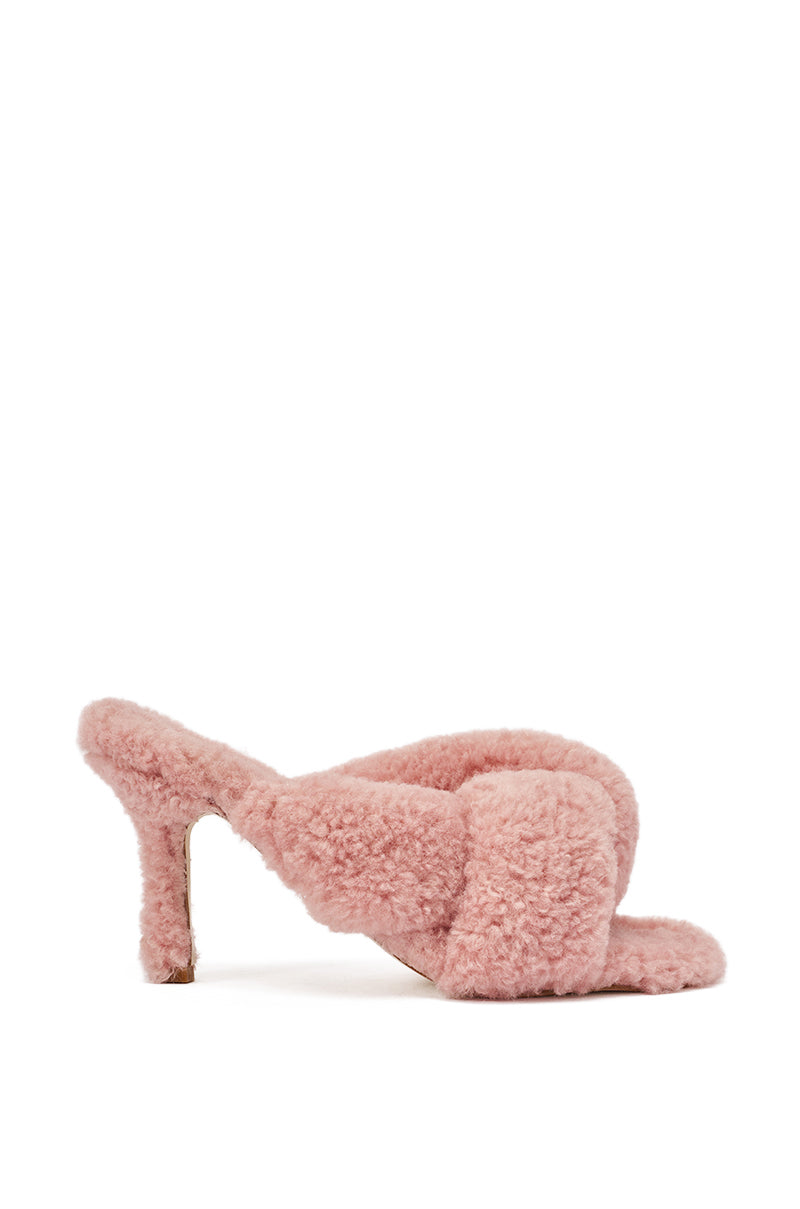 The AZALEA WANG PINK VALE IVORY SHERPA LOW HEEL MULE SANDAL is a pink low heel mule covered in teddy-textured faux sherpa, shown from the side against a white background. 3