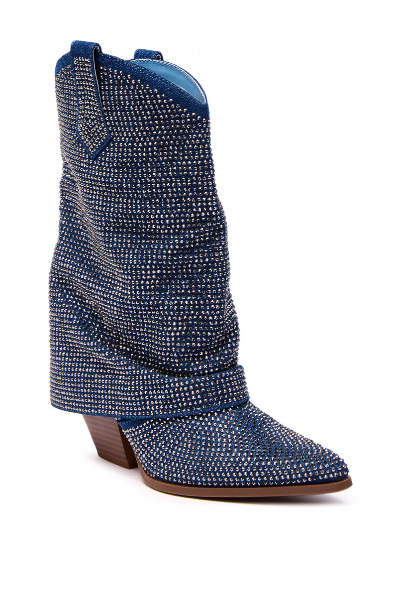 The AZALEA WANG VANADIS DENIM RHINESTONE COWBOY BOOTIE showcases blue denim, a pointed toe, angled heel, and sparkling silver rhinestones for standout Western flair against a white background.