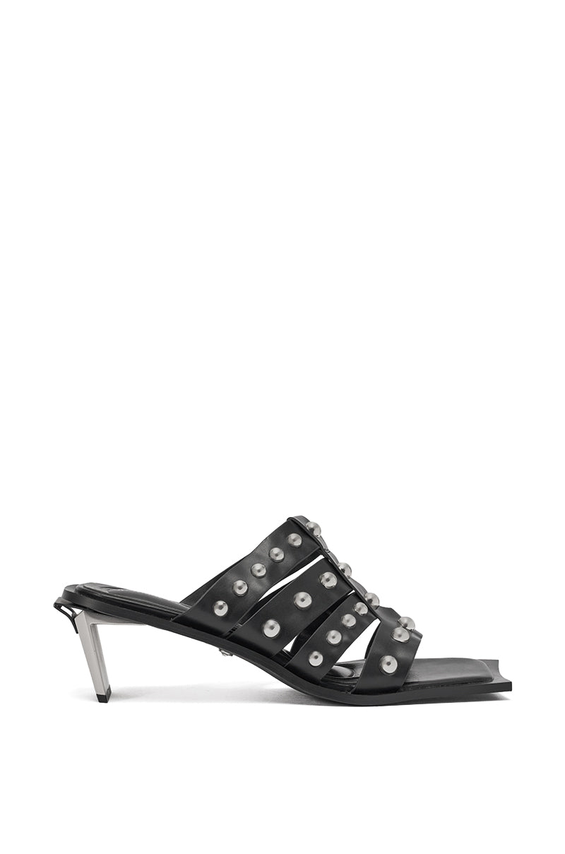 The AZALEA WANG VANDAL BLACK NOVELTY HEEL SANDAL features black faux leather, multi-strap silver stud accents, an open square toe, and a short angled metallic heel for a chic modern style. 4