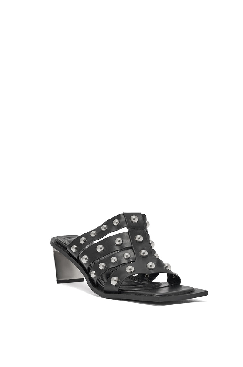 The AZALEA WANG VANDAL BLACK NOVELTY HEEL SANDAL features black faux leather, silver studded wide crisscross straps, and a chunky heel for a striking, versatile look. 5