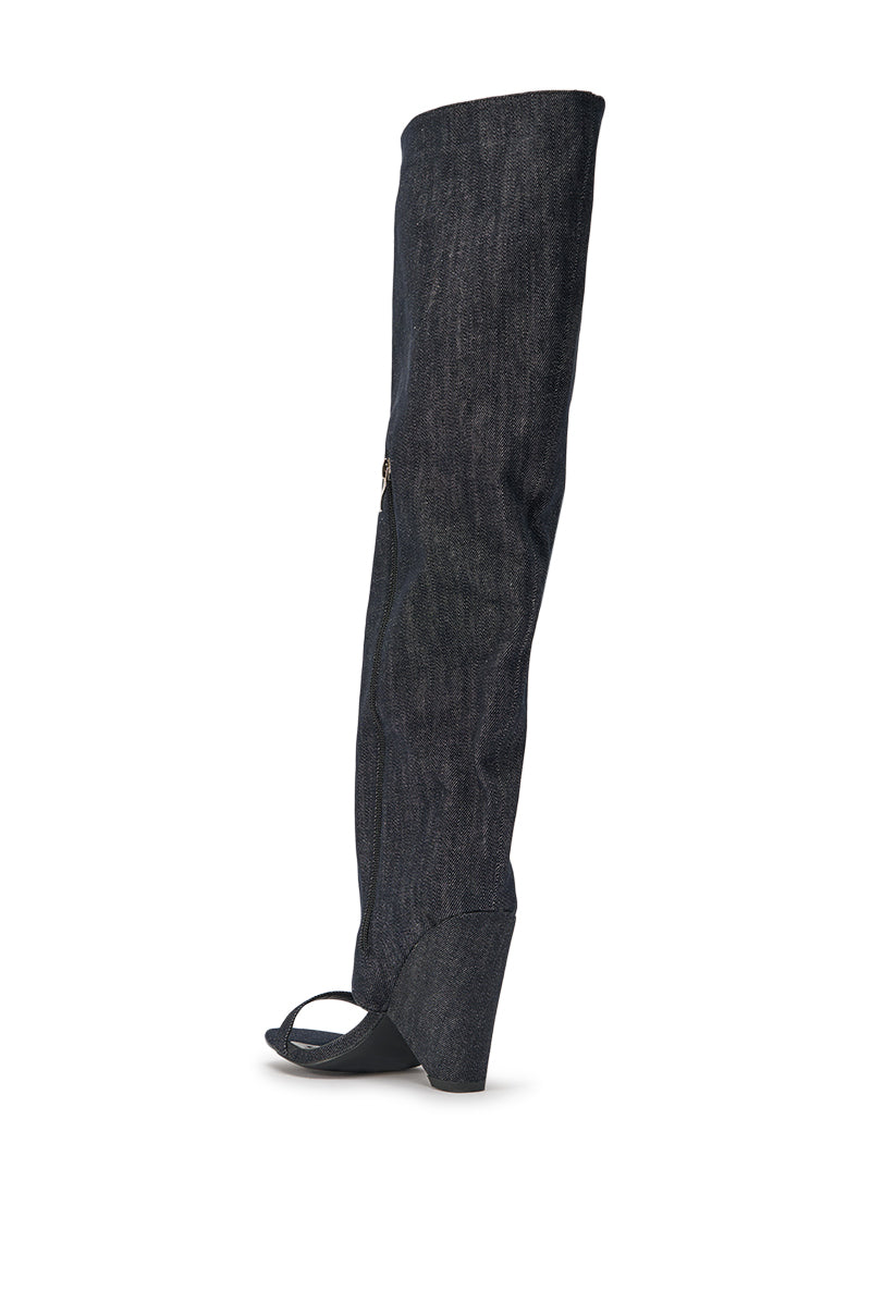 The AZALEA WANG VEONA Dark Denim Over the Knee Chunky Heel Sandal, featuring an open toe, wedge heel, and side zipper, is displayed on a white background. 6