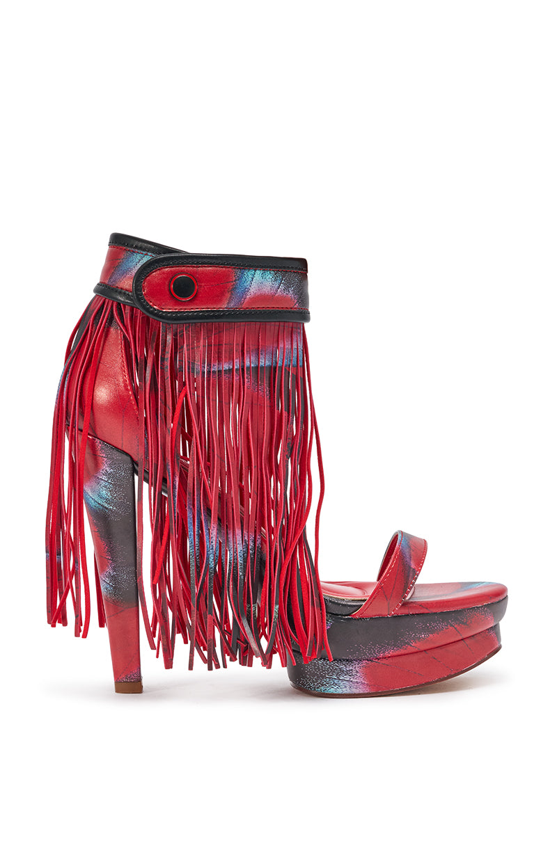 The AKIRA GOLD PRINTED PU FRINGE STILETTO SANDAL features striking red fringe, a bold printed pattern, and a high platform stiletto heel—perfect open-toe shoes for making a vibrant statement at any festival. 3