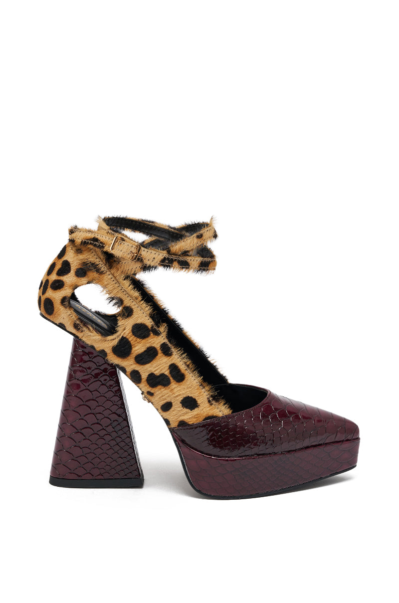 The AZALEA WANG VEVELYN MULTI CHUNKY PUMP features a high heel, burgundy faux-crocodile platform sole and heel, plus leopard print faux-fur ankle straps and upper details.
