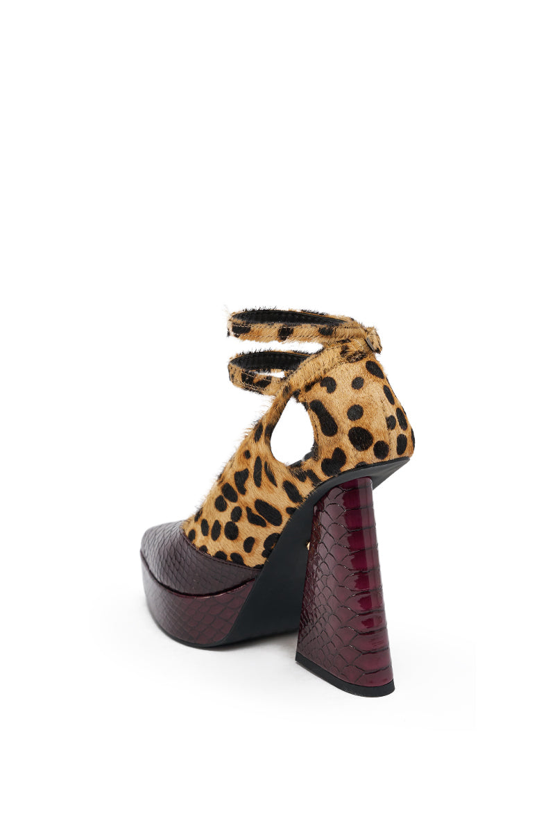 The AZALEA WANG VEVELYN MULTI CHUNKY PUMP features a textured burgundy heel, black platform, cheetah print upper, two ankle straps, and trendy cutout accents.