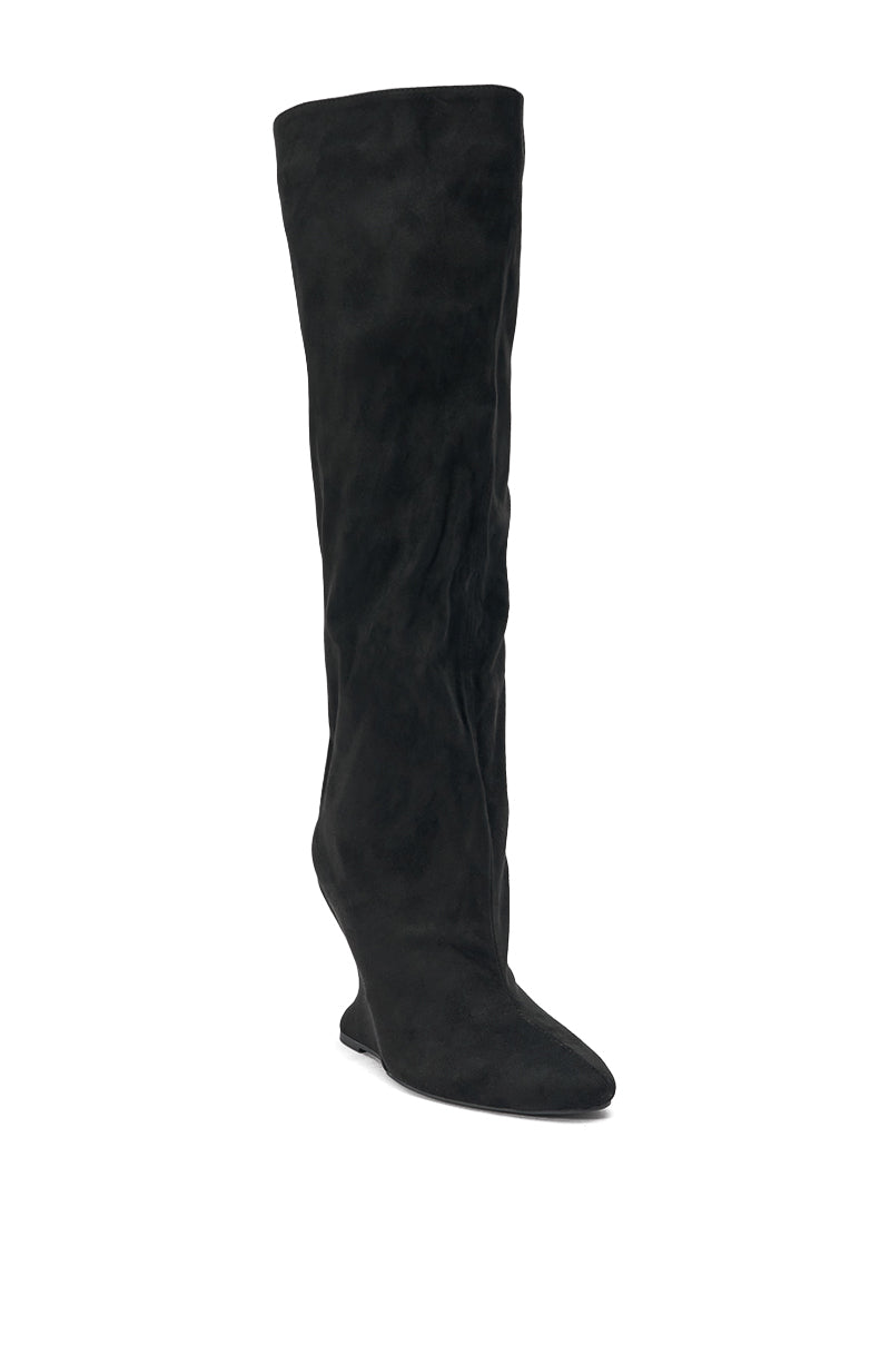 The AZALEA WANG VINCE BLACK FAUX SUEDE WEDGE BOOT features a knee-high silhouette with a pointed toe and slightly slouched design, shown in black against a white background.