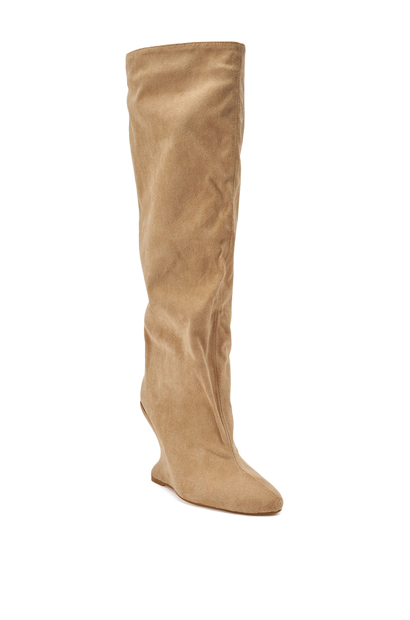 The AZALEA WANG VINCE NUDE FAUX SUEDE WEDGE BOOT is shown against a white background, featuring a slightly slouched knee-high design, pointed toe, flat sole, and tan faux suede material.