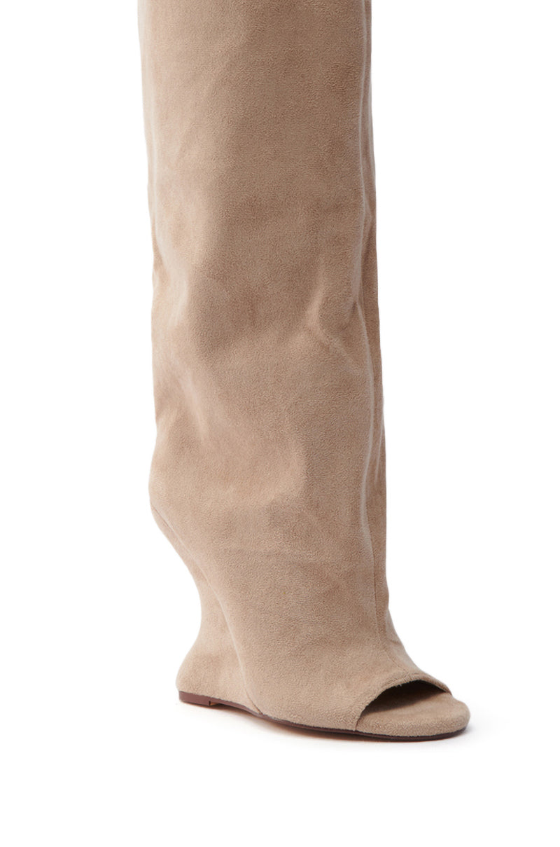 Close-up of the AZALEA WANG VINCENT NUDE OPEN TOE WEDGE BOOT, showcasing a peep-toe and slouchy fit. The faux suede elegantly drapes to a flat, minimal sole, creating an effortlessly chic look.