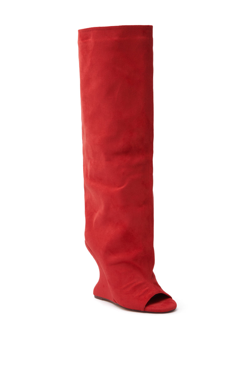 The AZALEA WANG VINCENT RED OPEN TOE WEDGE BOOT is displayed on a white background, emphasizing its slouchy shaft design. Made with faux suede, this knee-high boot features an inverted wedge heel that enhances its bold, chic style.