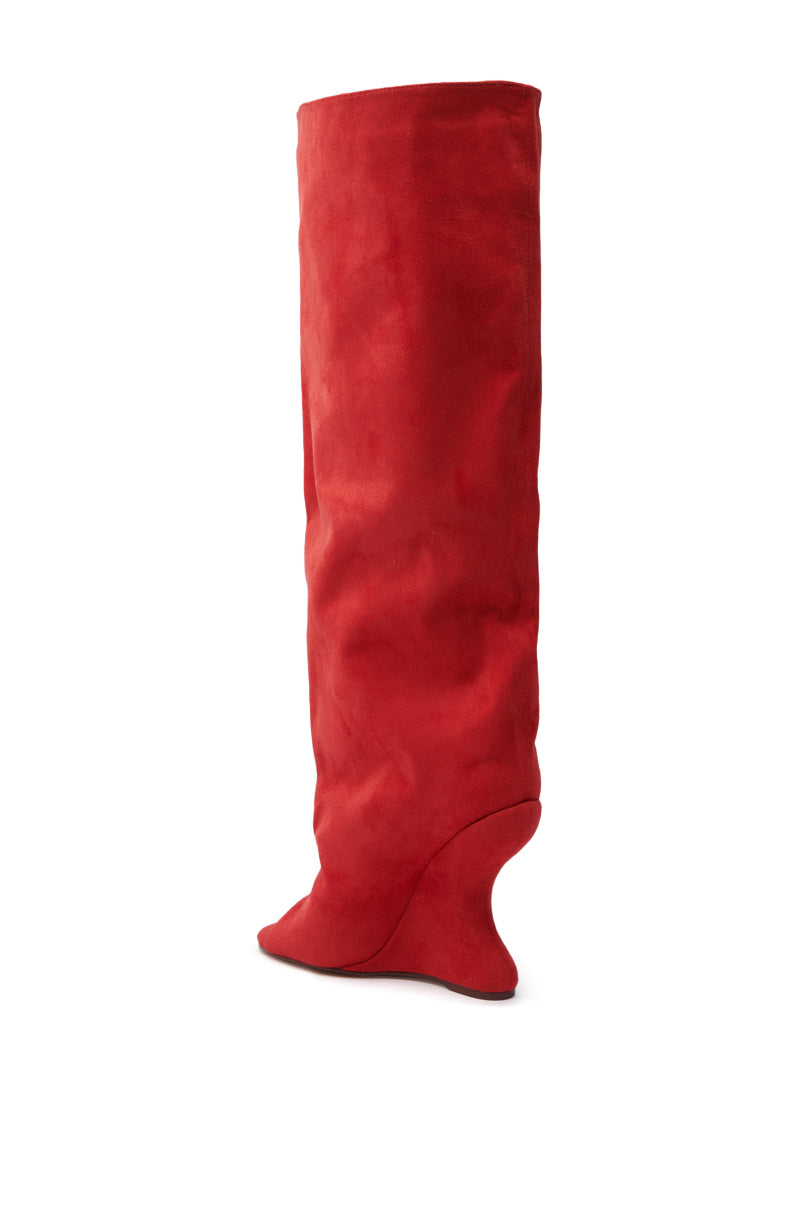 A lone AZALEA WANG Vincent Red Open Toe Wedge Boot stands against a white background, highlighting its unique inverted wedge heel and soft faux suede upper.