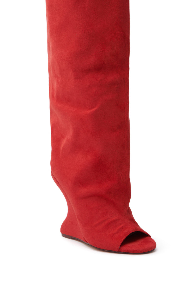 The AZALEA WANG VINCENT RED OPEN TOE WEDGE BOOT boasts a bold knee-high design in faux suede, with a striking open toe and sculpted inverted wedge heel for an edgy statement.