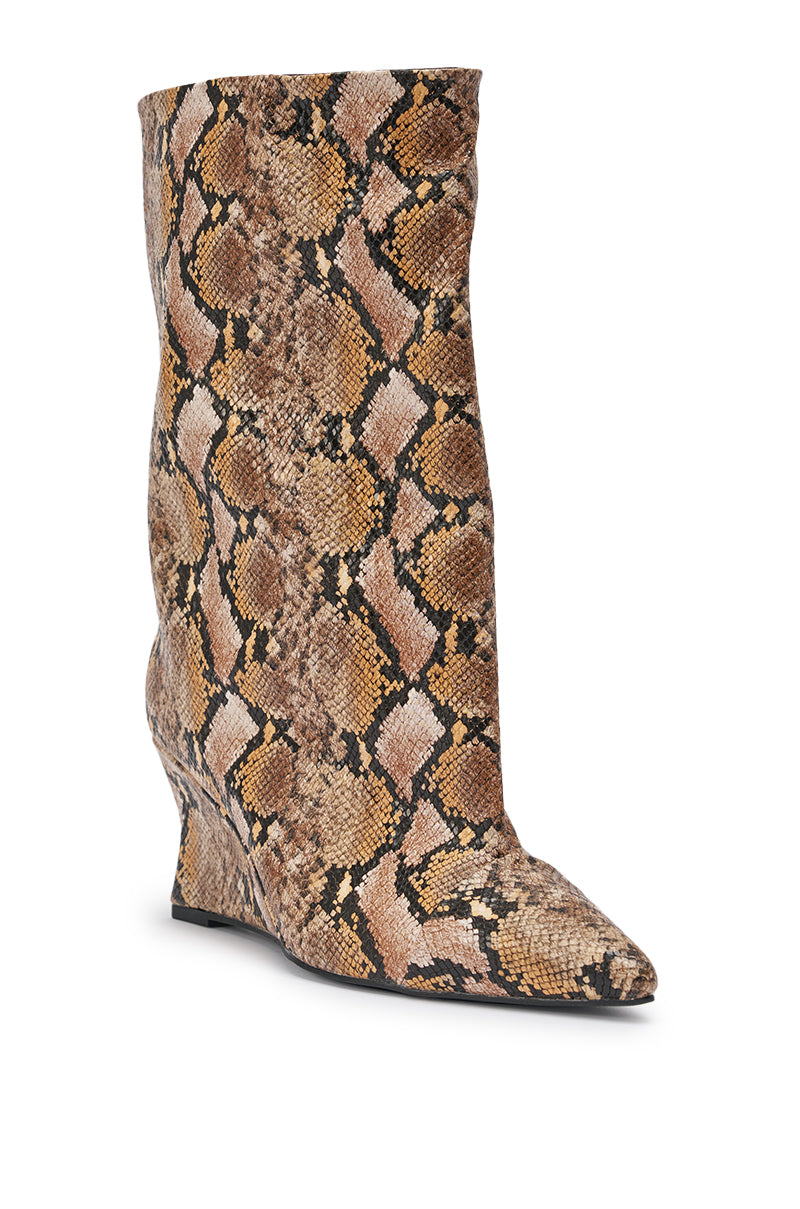 The AZALEA WANG VINCI SNAKE PU PRINT WEDGE BOOTIE features a pointed toe, slouchy mid-calf shaft, and faux snakeskin pattern in PU leather, shown as a single wedge bootie against a white background. 7