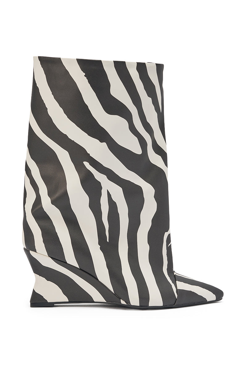 The AZALEA WANG VINCI ZEBRA PU PRINT WEDGE BOOTIE features a striking zebra print, pointed toe, angular wedge heel, and luxe faux leather, shown against a plain white background. 2