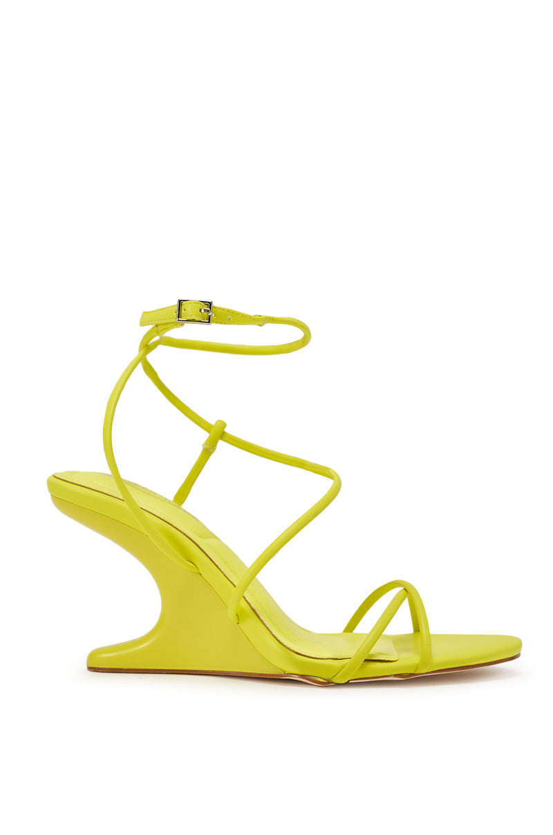 The AZALEA WANG VINTARA YELLOW NOVELTY WEDGE STRAP SANDAL features a bright yellow hue, sculpted wedge heel, thin straps, ankle buckle closure, open toe, and a comfort cushion insole for stylish all-day wear. 4