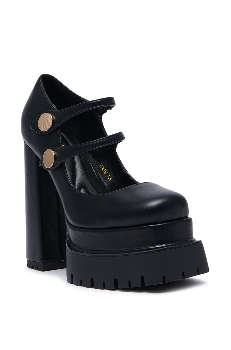 The AZALEA WANG VIOLINA BLACK CHUNKY PLATFORM PUMP, crafted with a faux leather upper, features a thick treaded sole. It boasts a closed-toe design with two adjustable straps adorned with metallic button accents across the top and a sturdy block heel. 3