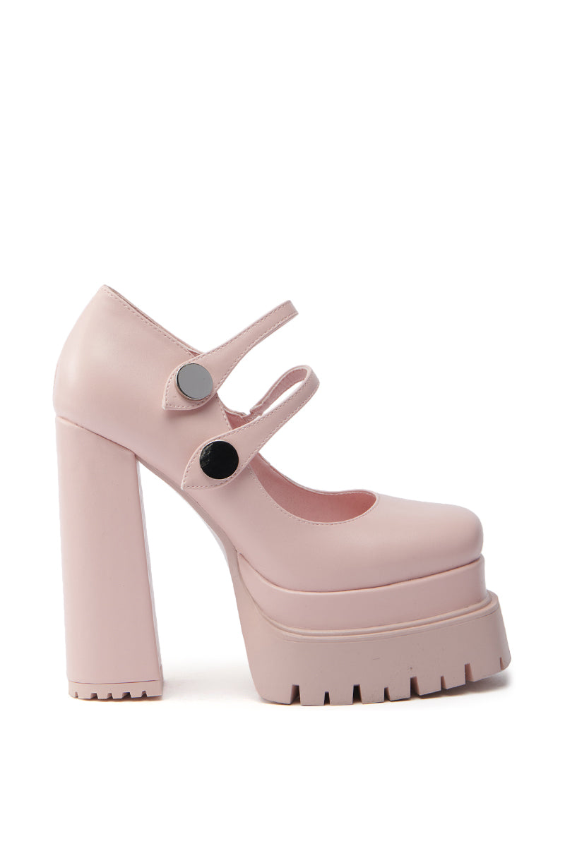 The AZALEA WANG VIOLINA pink chunky platform pump is made from vegan leather, featuring a square toe, thick straps with black buttons, and a ridged-texture heel. With its matte finish and modern flair, it's perfect for making a bold statement. 2