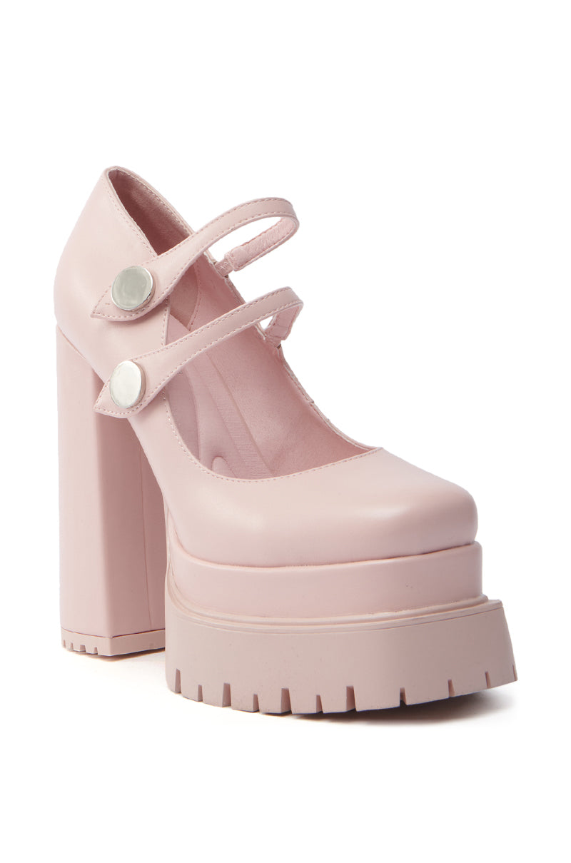 The AZALEA WANG VIOLINA PINK CHUNKY PLATFORM PUMP stands out with its bold, modern vegan leather design. Featuring a shiny finish, fashionable square toe, and dual straps with white buttons across the front, it makes a striking fashion-forward statement. 3