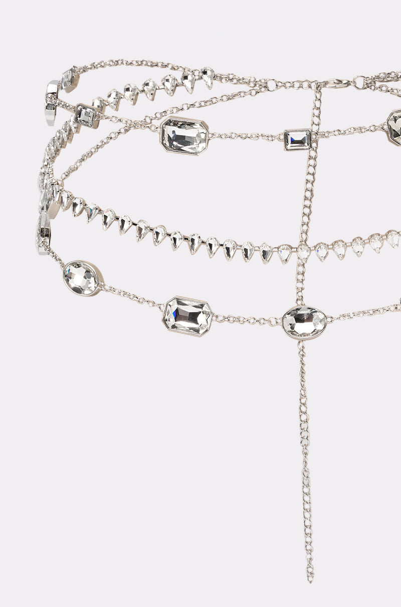 The GLITZ AND GLAM CHAIN BELT features layered strands of clear, faceted rhinestones in assorted shapes and sizes, finished with a dangling end—an ideal statement accessory for festivals or special occasions. 2