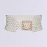 The PEARL PLEASE BELT is a wide belt made of interconnected pearl beads, featuring a square pearl buckle. It provides an adjustable fit for a waist-cinching effect against a plain white background.