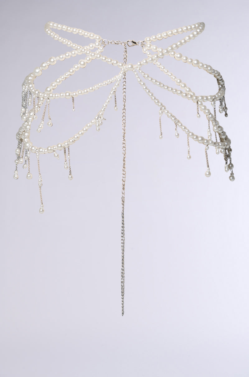The STAY DRIPPIN PEARL BELT features faux pearls and silver chains in an intricate, ornamental design with cascading pearl and chain strands, photographed against a plain light gray background.