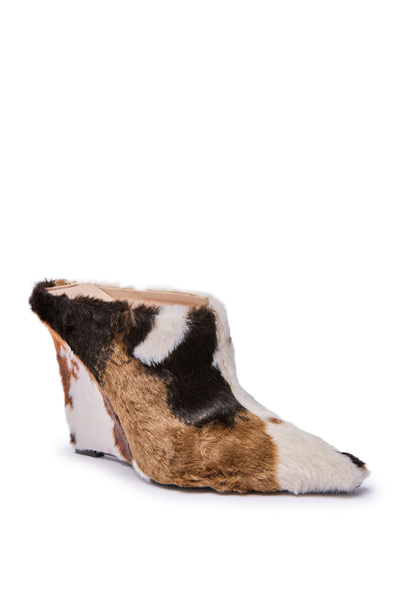 The AZALEA WANG WAFIYA MULTI WEDGE COW PATTERN FURRY PUMP is a chic pointed-toe wedge with brown, black, and white faux cow fur, featuring a sleek, strapless design for a stylish finish.