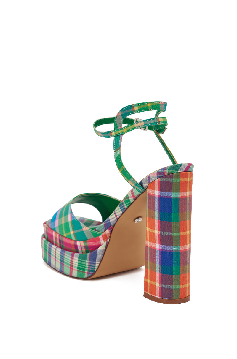 The AKIRA GOLD WANDELLA GREEN PLAID PLATFORM SANDAL features a vibrant multicolor plaid pattern, chunky block heel, ankle strap with buckle, green interior lining, peep toe, and open heel design. 5