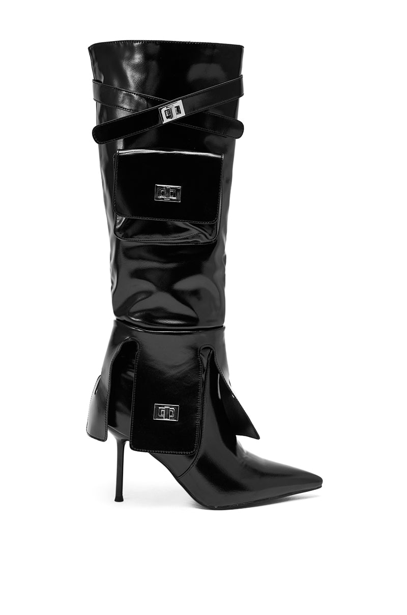 The AZALEA WANG WATERS BLACK STILETTO BOOT WITH POCKETS is a faux leather knee-high boot featuring a sleek black finish, striking high heel, and practical pockets for an elevated, stylish look.