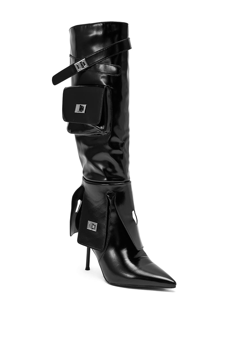 The AZALEA WANG WATERS BLACK STILETTO BOOT WITH POCKETS is a knee-high faux leather stiletto boot featuring stylish side pockets.
